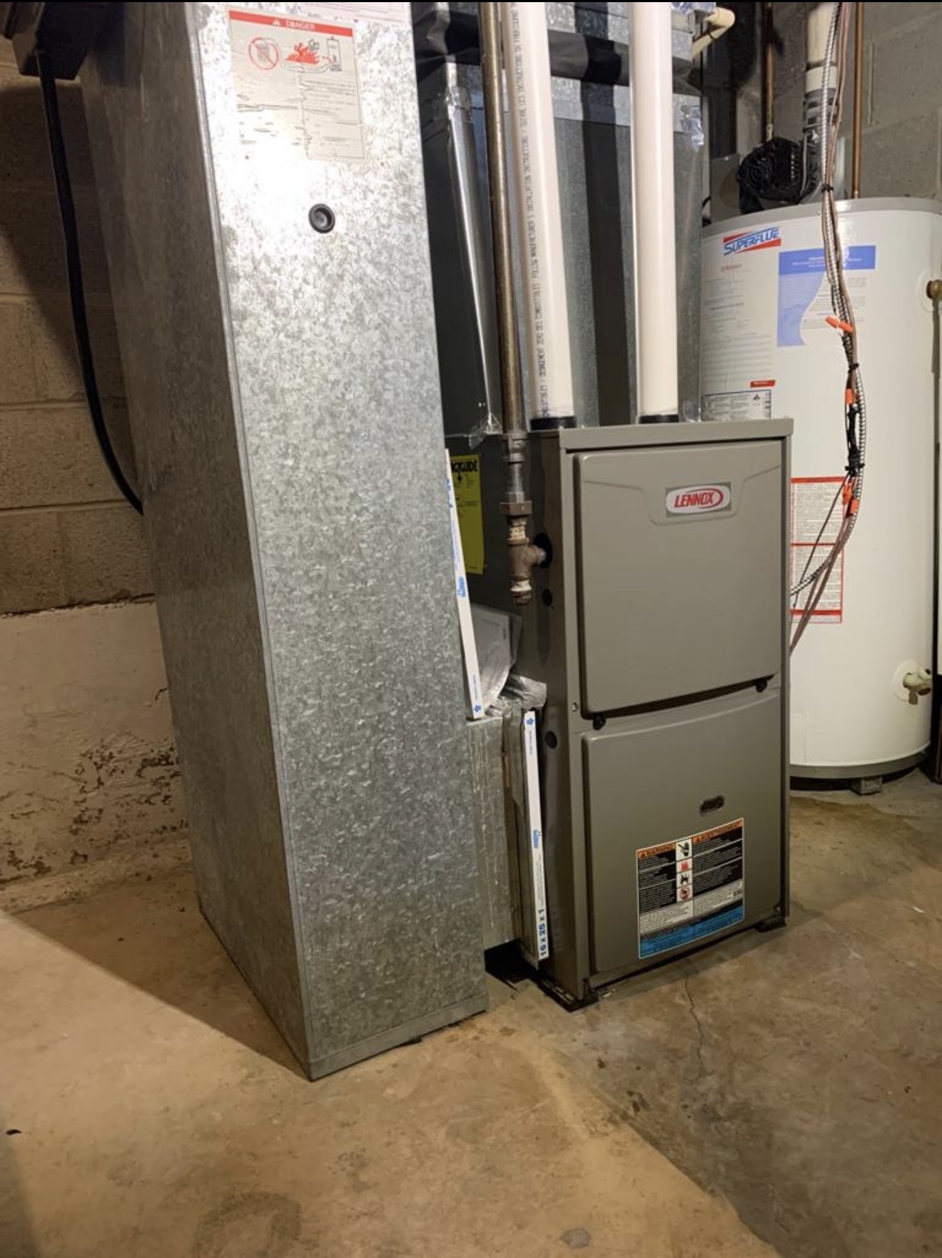 Lennox furnace with adjacent ductwork and water heater